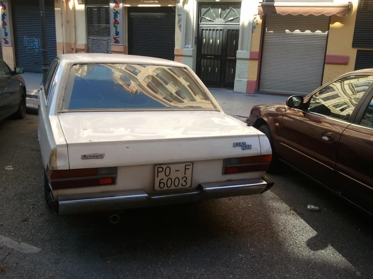 a car parked next to another car on the road