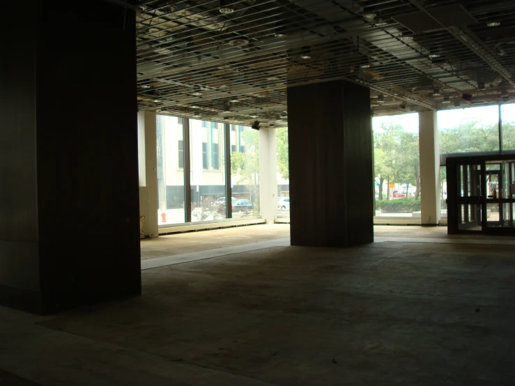 an empty public building with glass doors and windows