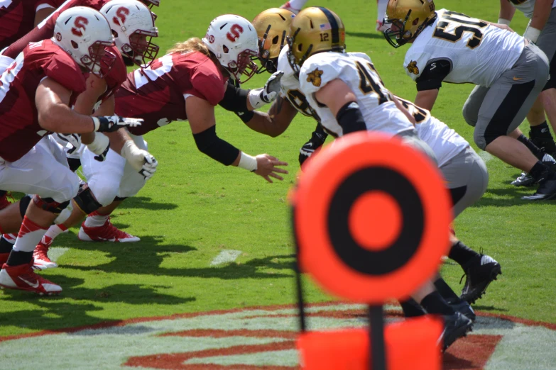 a group of football players running together on a field