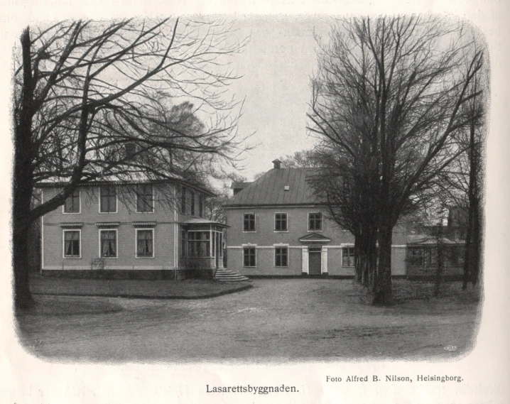 black and white po of a house surrounded by trees