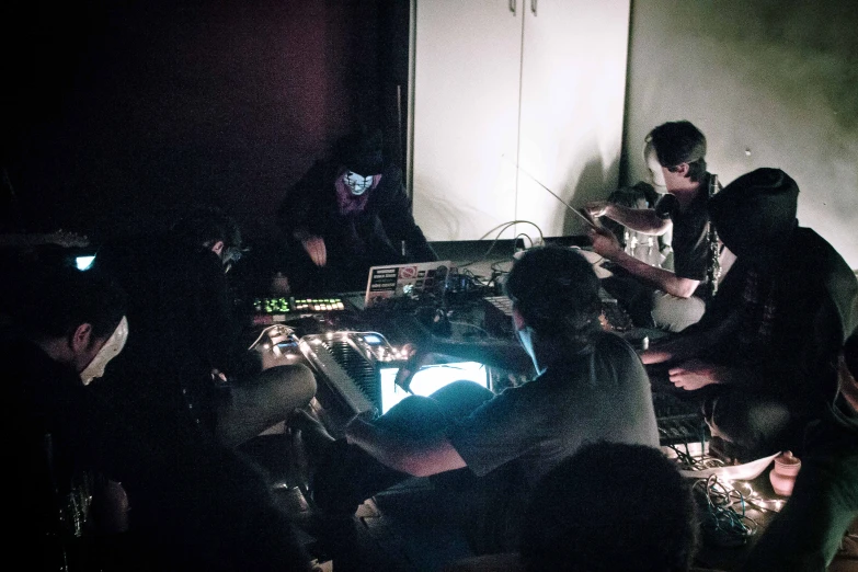 a group of people sitting at a table in a room