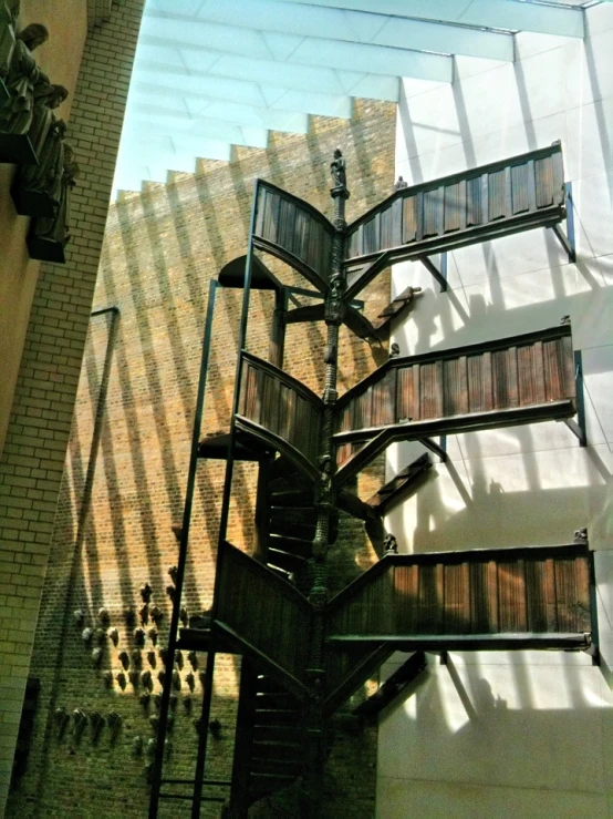 a spiral staircase made out of bricks on top of a building