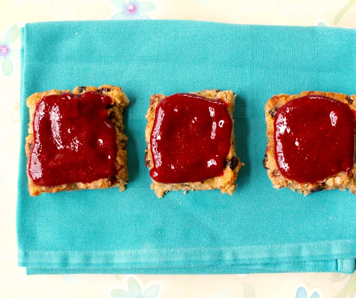 a couple of slices of toast with a sauce on them