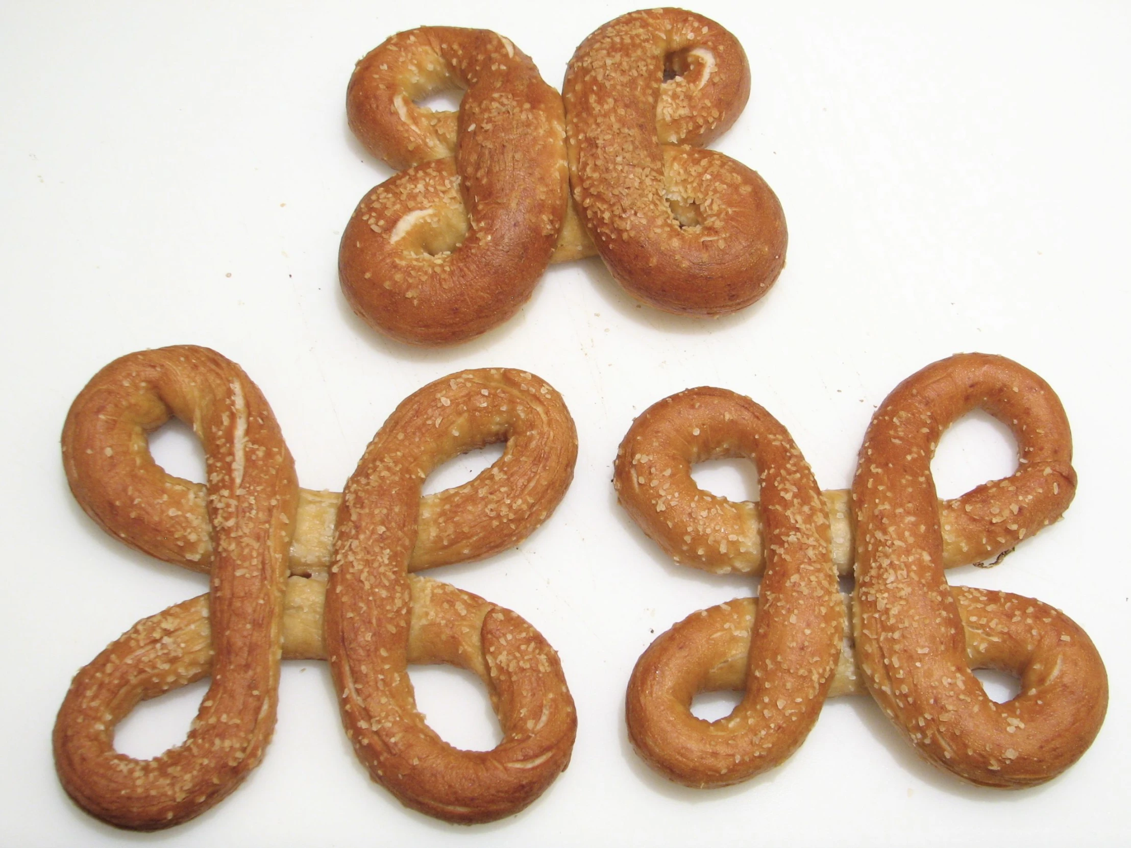 three cookies shaped into the shape of the letter b