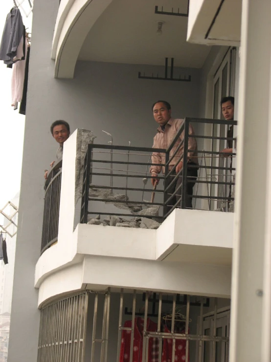 two men standing inside of a  cell