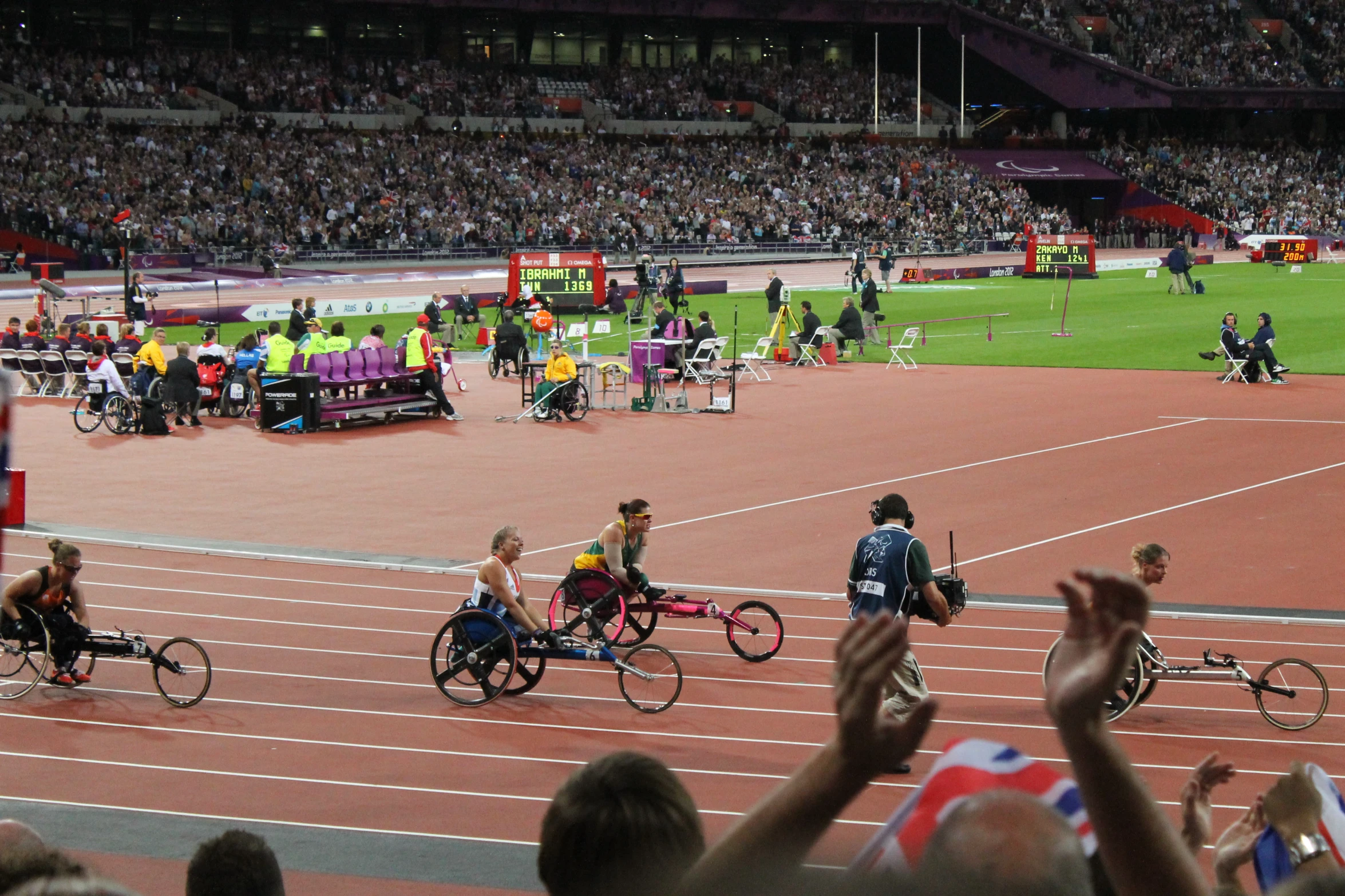 there are many people riding bicycle on a track