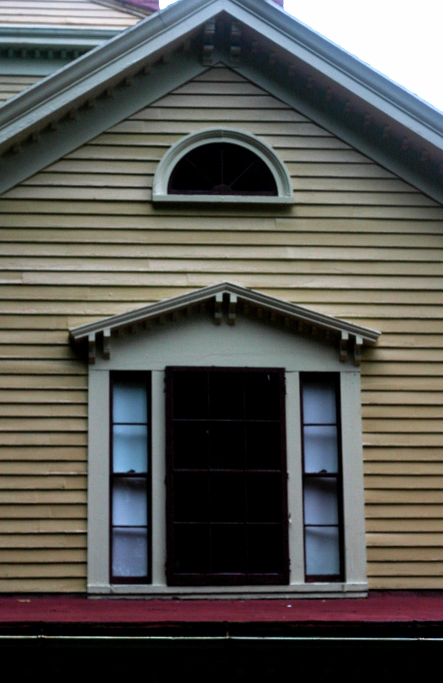 a church with two windows and the top half missing