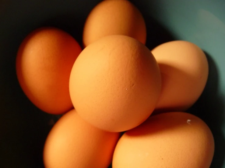 several eggs are stacked together on a plate