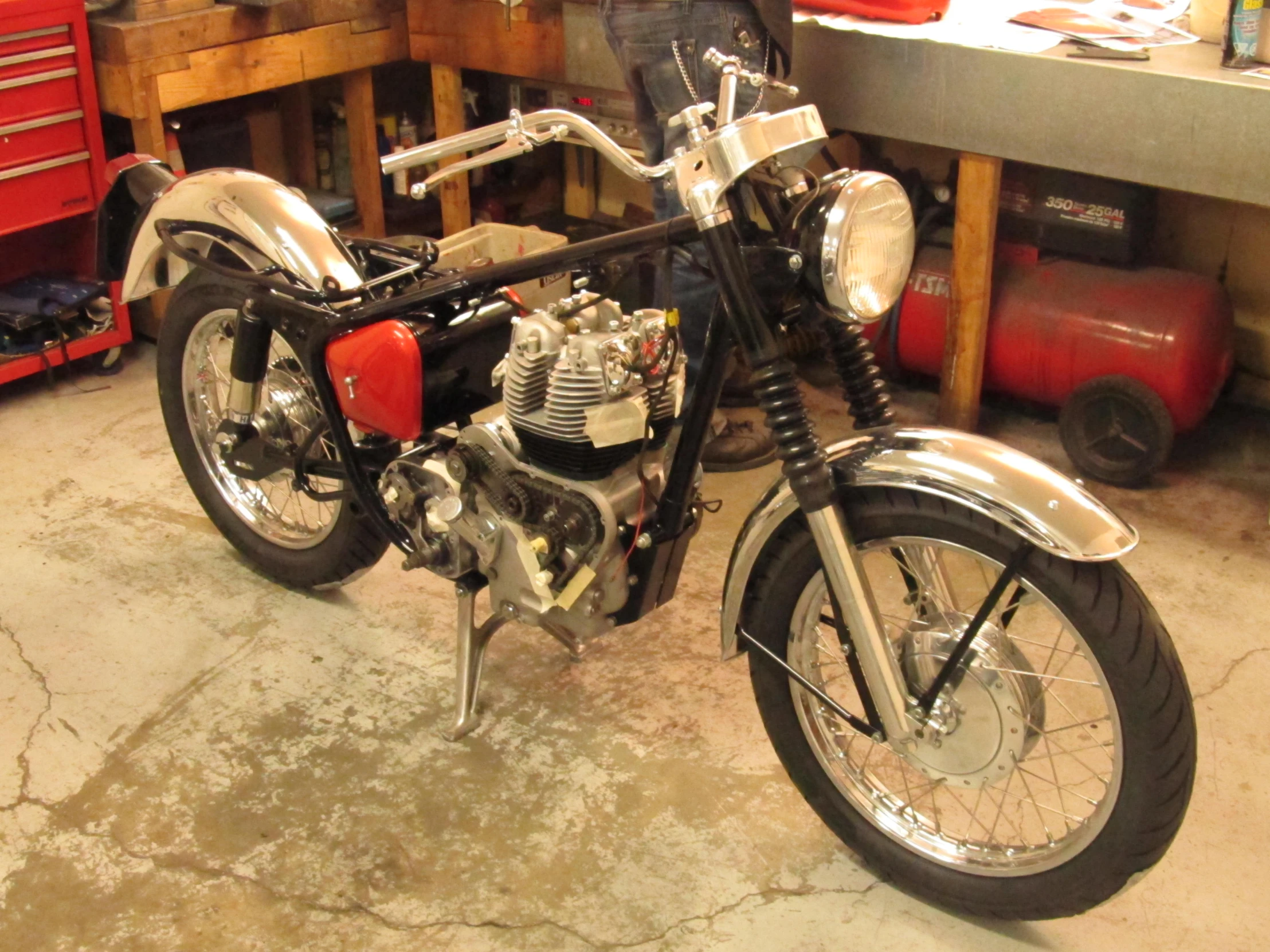 a motor bike is parked in a garage