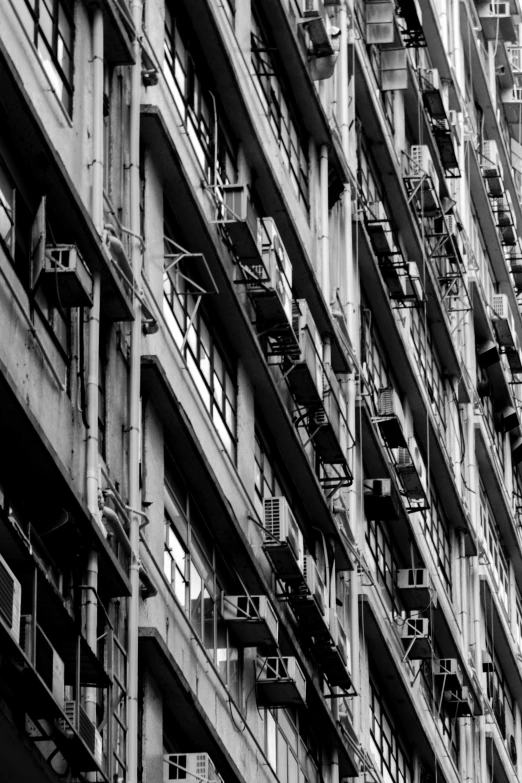 an old building with many windows and small balconies