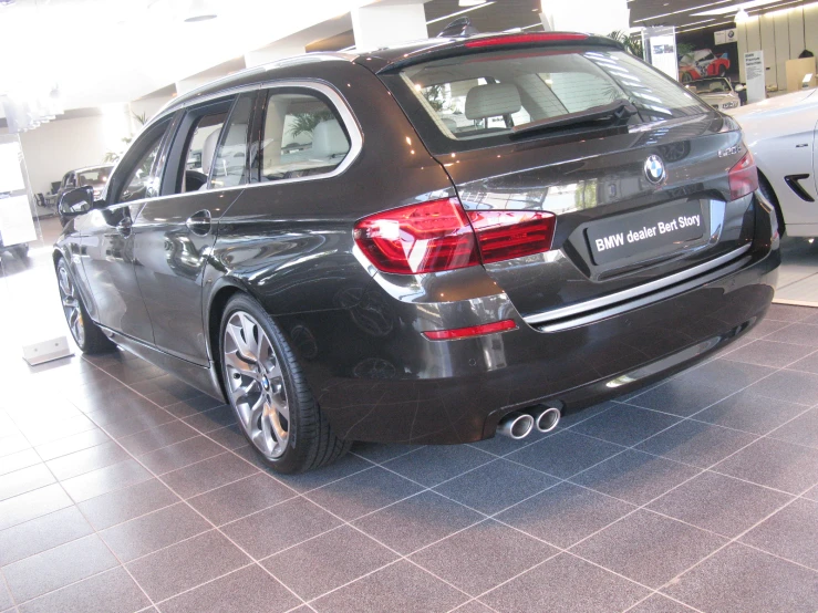 an upscale looking black car parked inside of a building