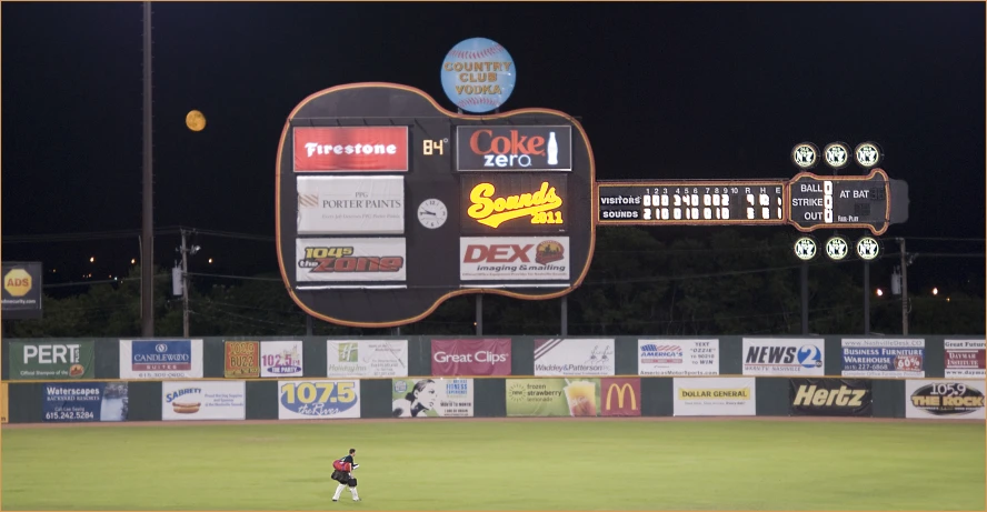 a field full of advertising signs that read beer before