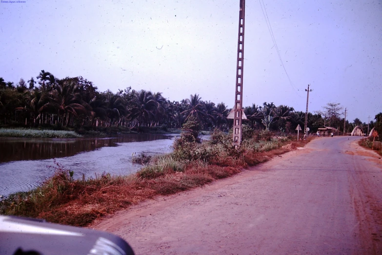 a view of the road and the river as seen from a vehicle