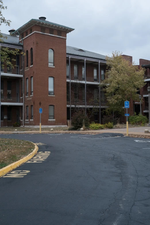 a road going through an intersection near several buildings