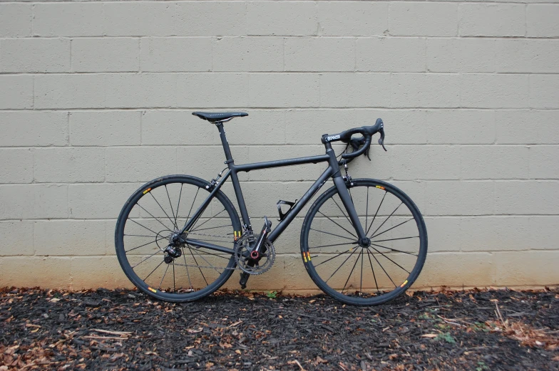 a bike parked near a building with gravel