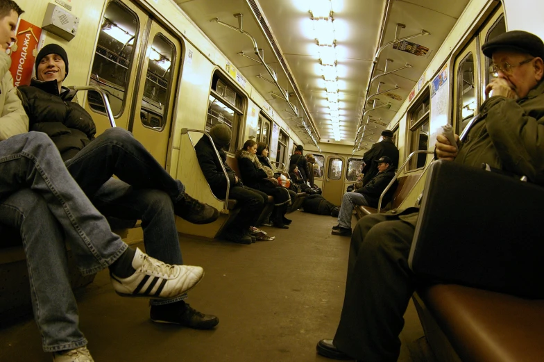 several people on the subway sitting down together