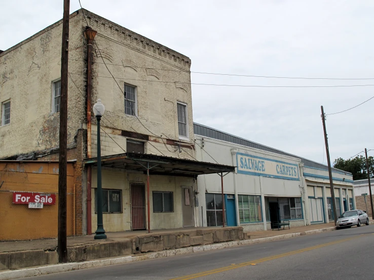 an old fashion clothing shop sits on a street corner