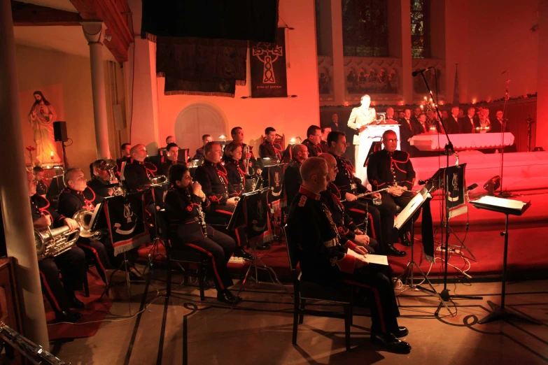 orchestra members performing in front of church choir