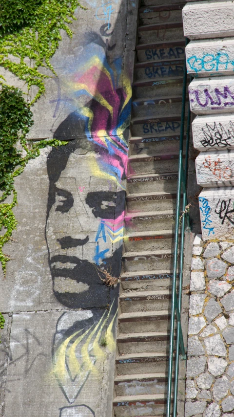 the stairs of a stairway covered in graffiti