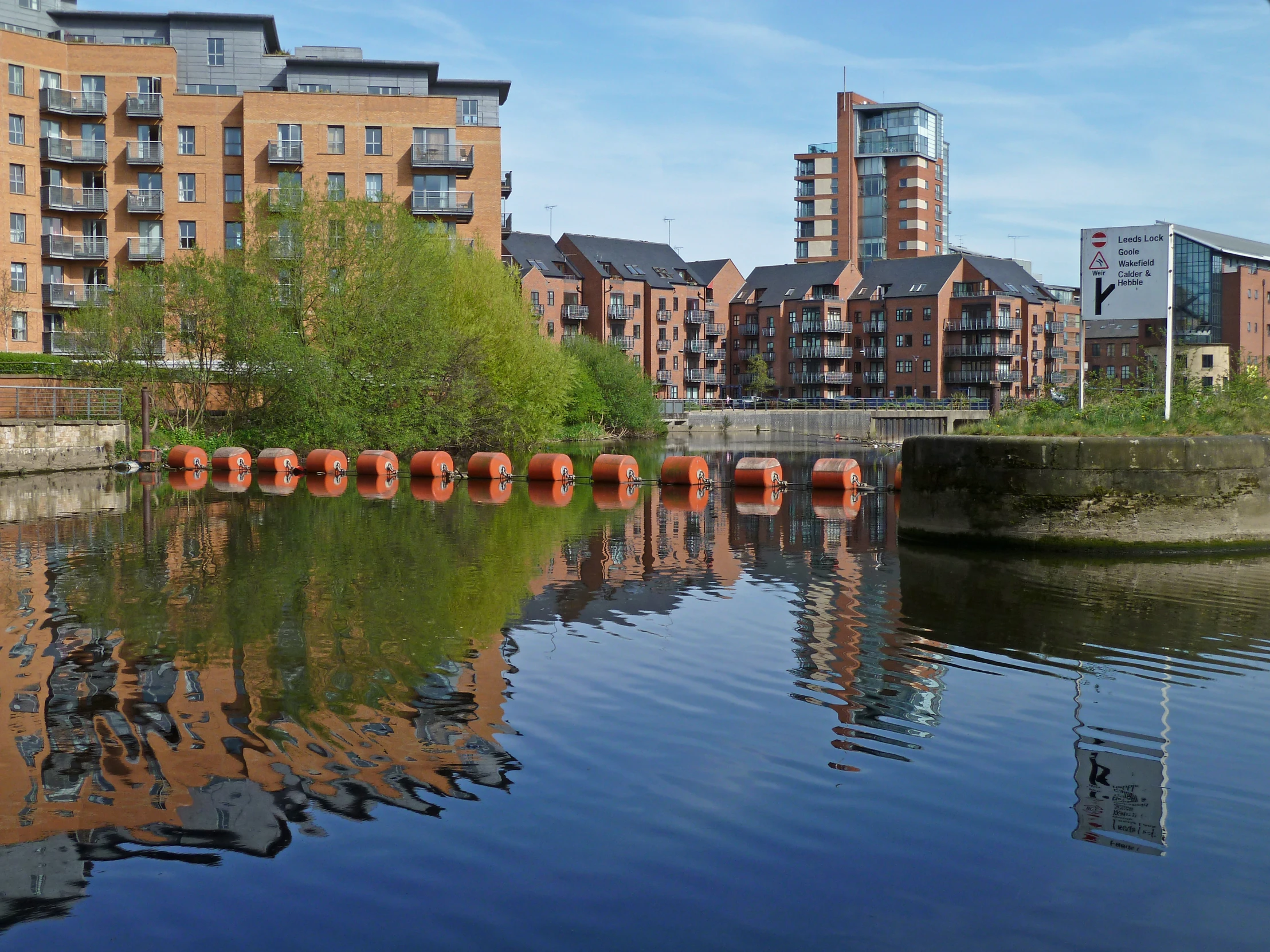 an image of a waterway with reflections in the water