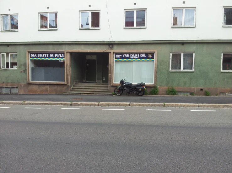 there is a motorcycle parked outside of a building