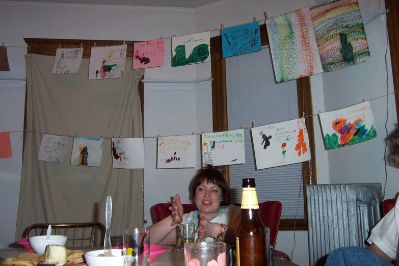 a person sitting in a chair at a table