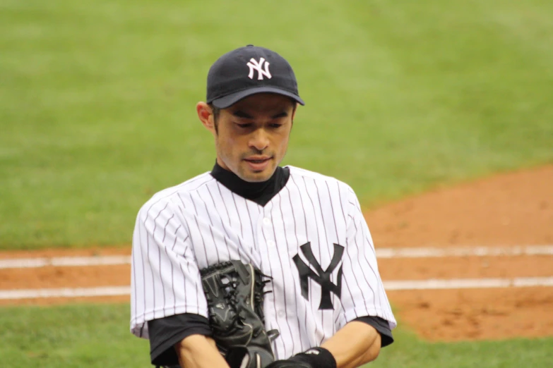 a baseball player wearing a new york yankees uniform