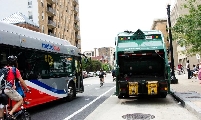 large city bus turning left on busy road