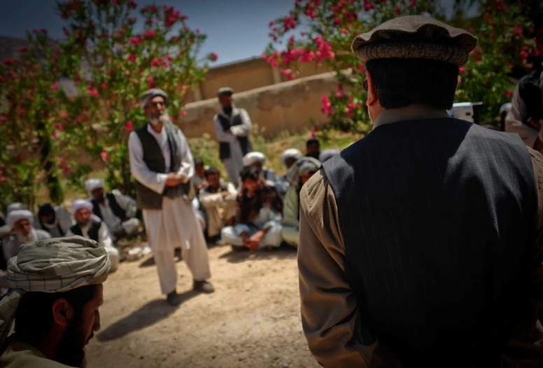 a group of men who are sitting down