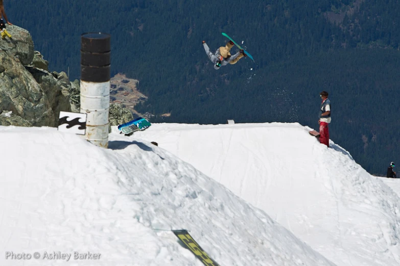 a man flies through the air while on his skis