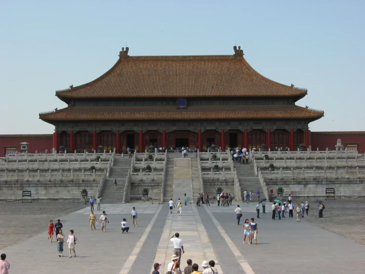 a group of people gathered at an ancient building