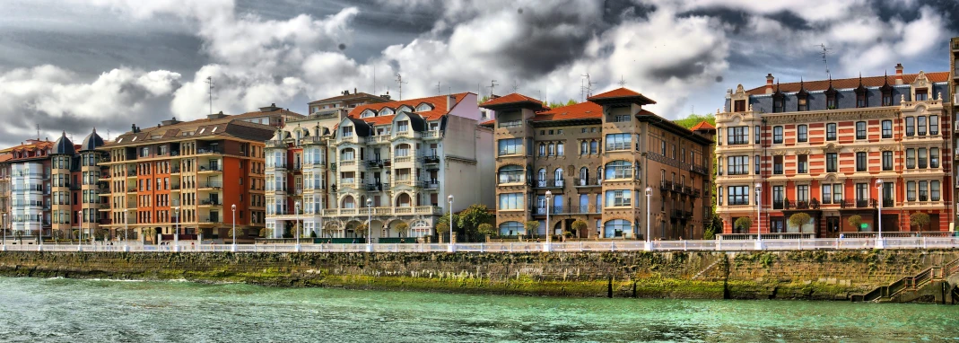 a large group of houses along the water