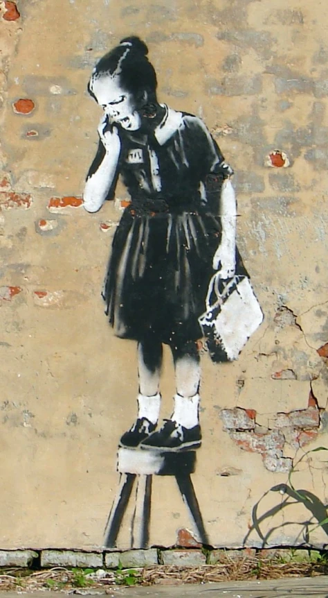 a girl painted on a wall with a purse