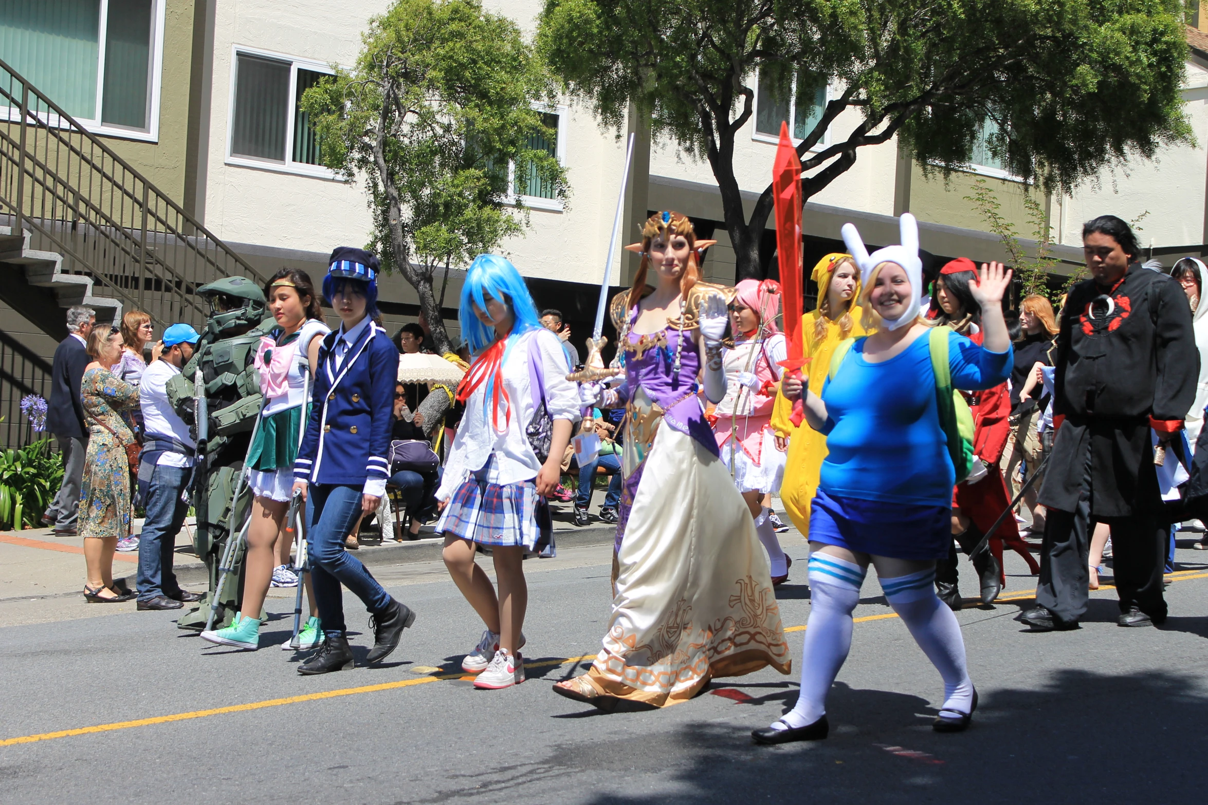 a group of people are standing in the street and wearing costumes