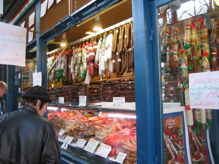 an indoor deli has numerous different foods in the case