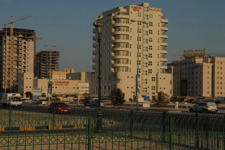 an urban area in asia with cars and some buildings