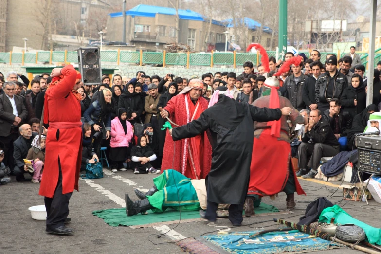 an image of a group of people performing in the street