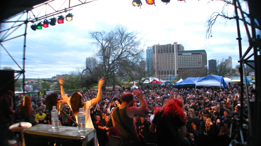 people in a music festival at an outdoor venue