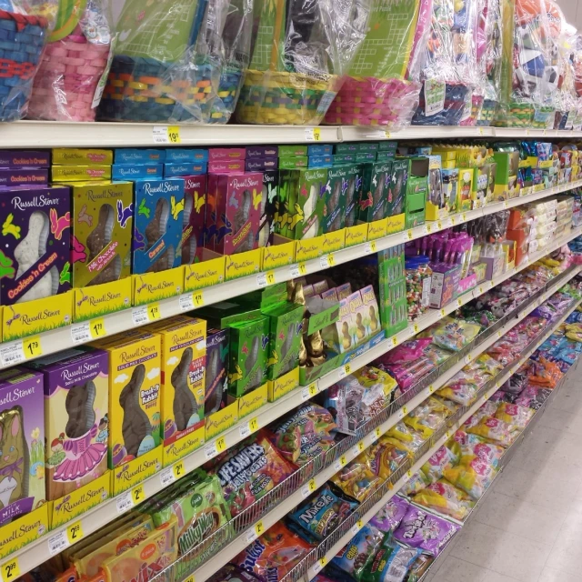 a large variety of cat toys on the shelves of a store