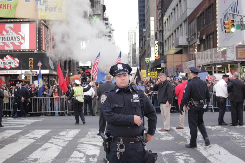 a police officer standing on the side of a road