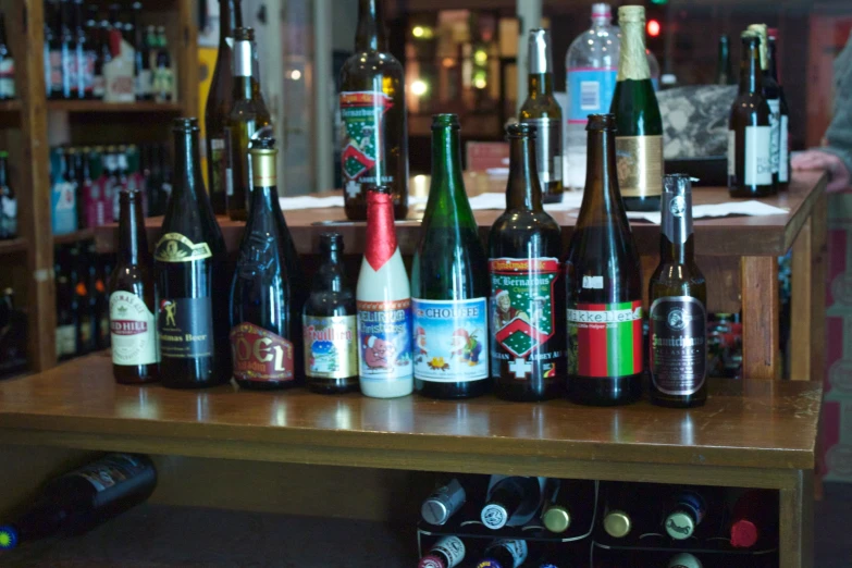 a table that has a lot of wine bottles on it