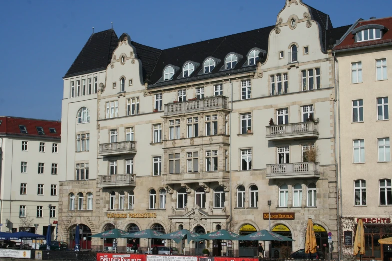 a large el with two story buildings and a parking lot