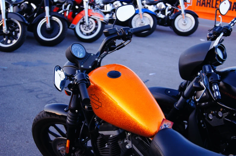 an orange seat on the side of a motorcycle