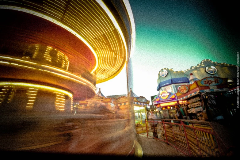blurry pograph of amut park rides and carnival rides