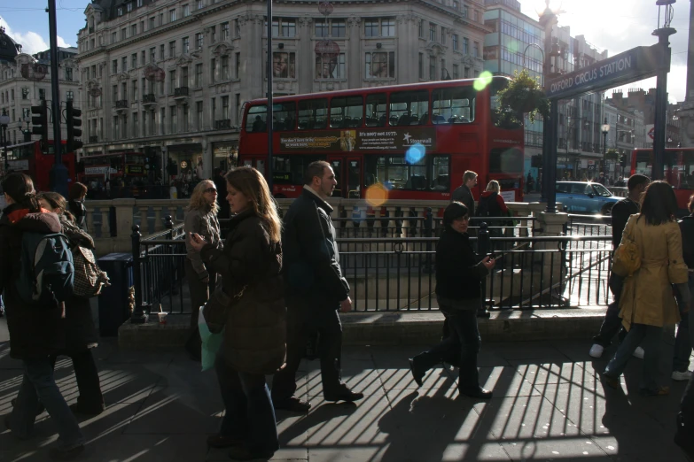 people standing on a street corner in london