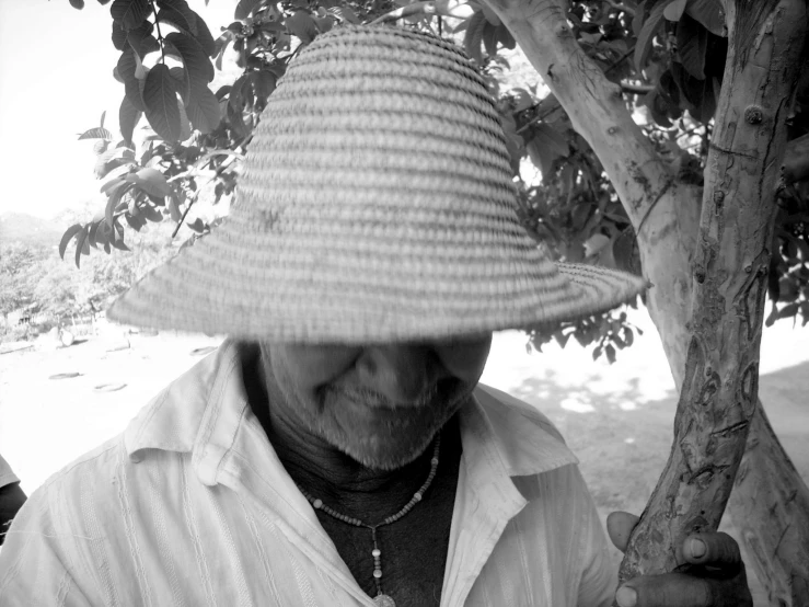 black and white pograph of a man in a hat