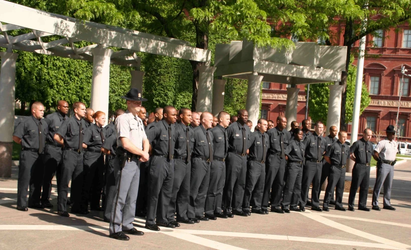a group of police officers standing in formation together