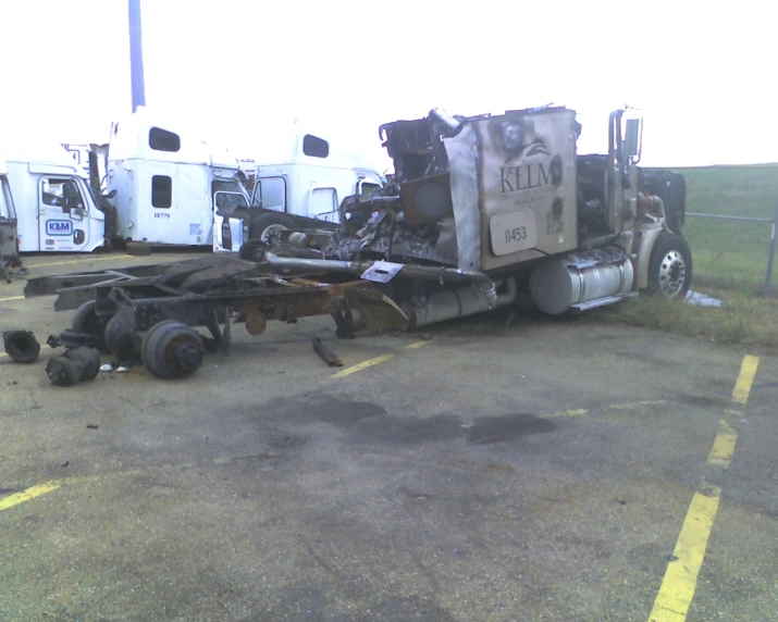 the large semi truck has been wrecked in the parking lot