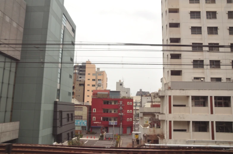 a city with tall buildings is surrounded by many other buildings