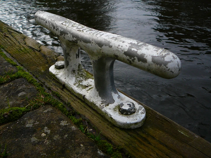the iron bench stands on a wooden ledge